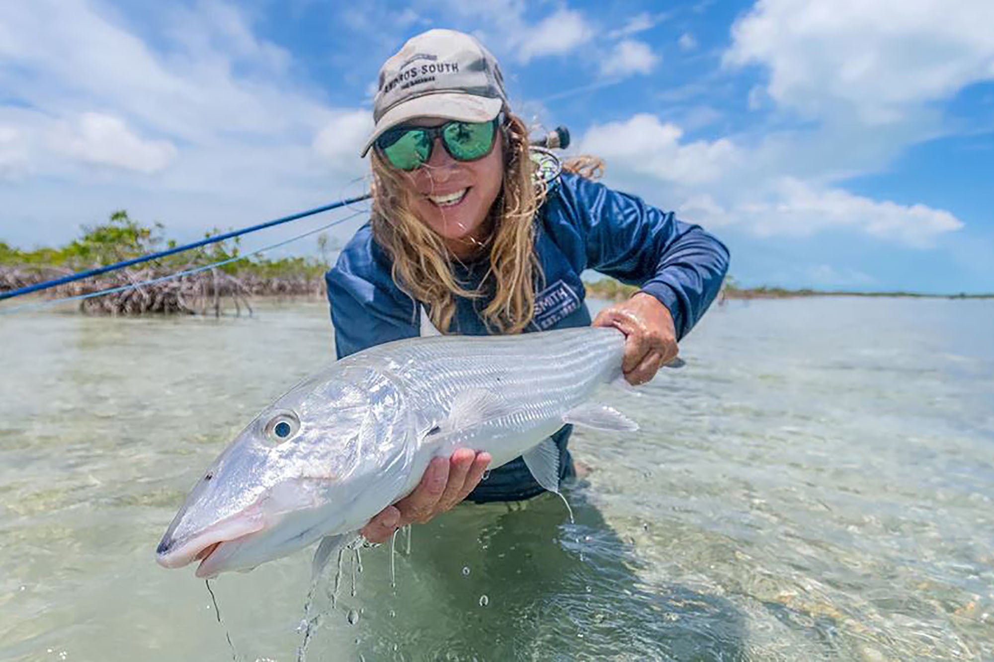 Andros South legend Mia Sheppard showing off a beautiful Bahamian Bonefish caught while wading the flats of Andros.