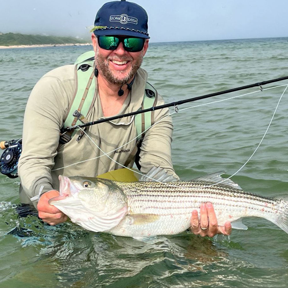 Ben with a nice Striped Bass (Striper) caught somewhere off the coast of New England.
