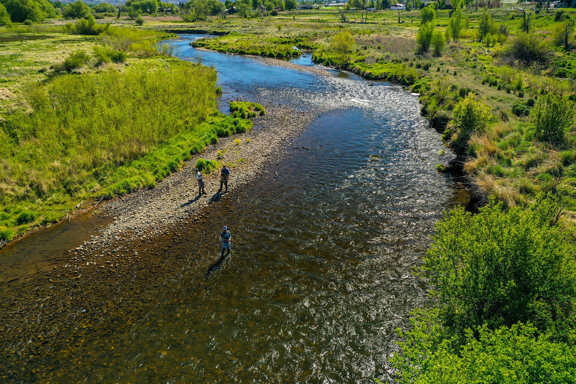 A group of anglers anda guide fish the Provo River in Heber, Utah.