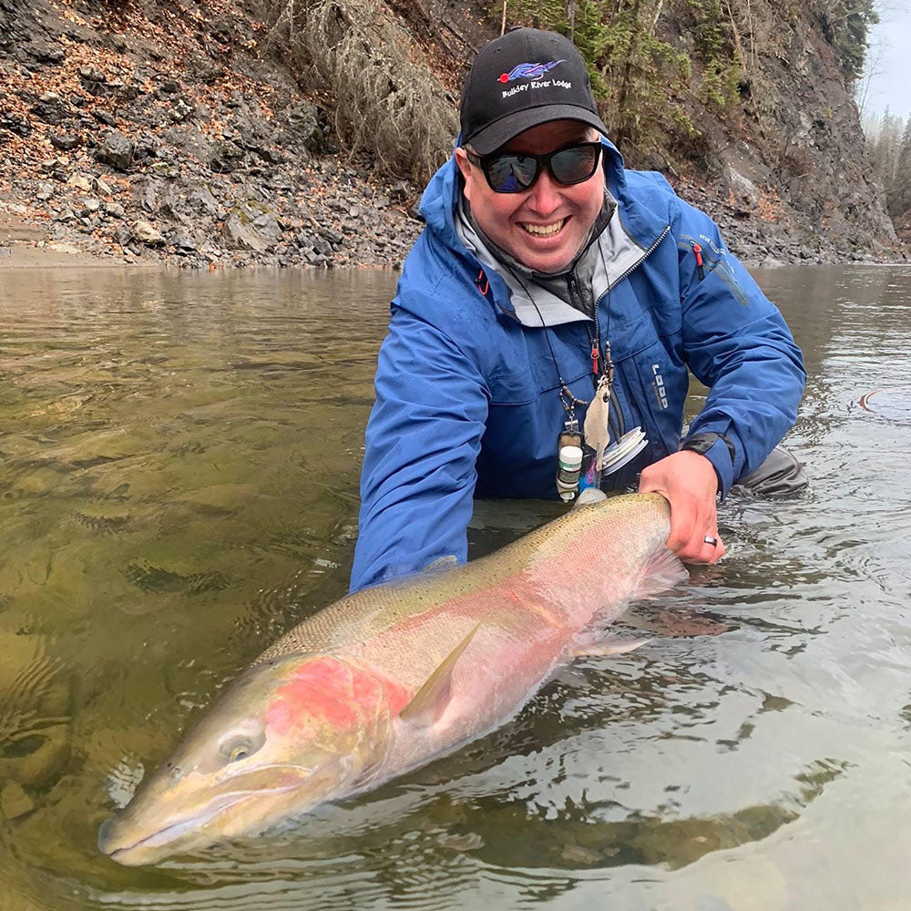 Travis showing off a once his encounter with a once in a lifetime Steelhead in BC.