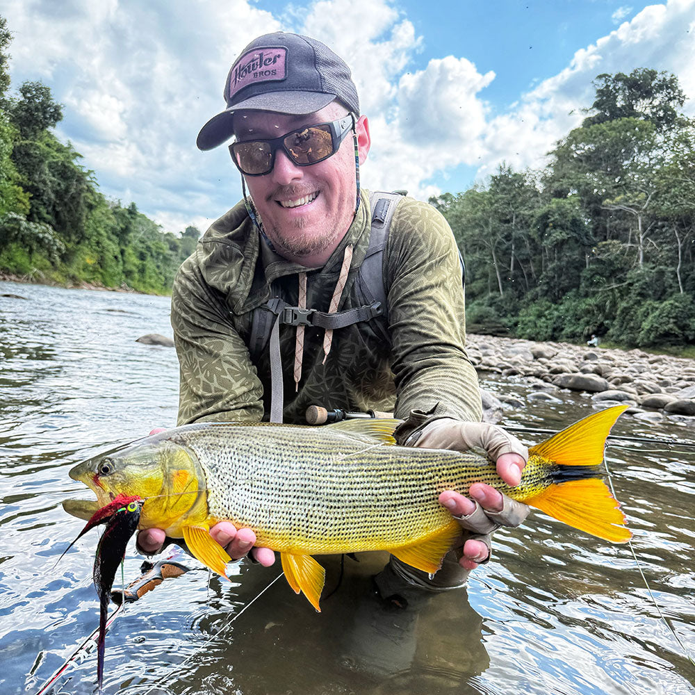 JC showing off a nice Golden Dorado on the banks of the Pluma River in the Bolivian Jungle