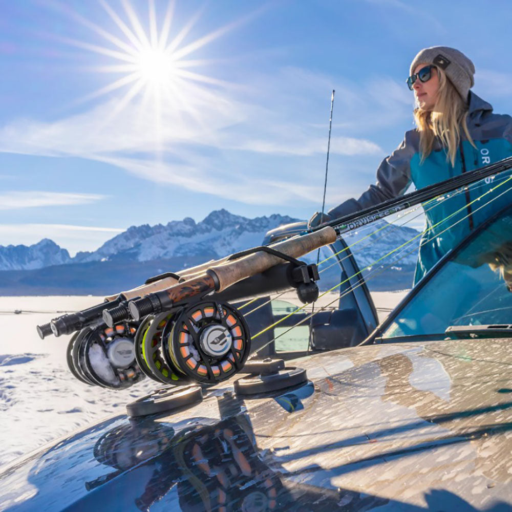 A person with a collection of Orvis Recon Fly Rods getting ready for a day on the water.