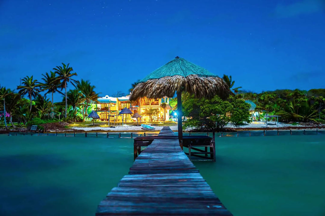 A view of the X-Flats lodge at Tierra Maya taken from the oceanside dock at night.